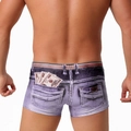 Detail of men's violet denim print swim trunks showing dollar bill pattern on back pocket - Denim Brown
