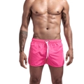 Détail du short de bain rose vif pour hommes avec taille élastique et cordons blancs - Rose rouge