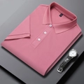 Detail of coral pink pique polo shirt with three-button placket and matching wrist watch - Sand Red