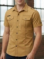 Detail of men's mustard yellow cotton cargo shirt featuring epaulettes and chest pockets - Earthy Yellow