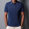 Slim-fit donkerblauw heren poloshirt met rood-witte strepen op de kraag en mouwranden - S / Marineblauw