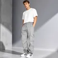 Men's loose fit grey cargo sweatpants with drawstring waist and large flap pockets - Gray