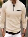 Close-up of beige slim fit polo shirt with quarter zipper and sleeve pocket detail - S / Tops / Khaki