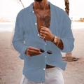 Close-up of a loose-fit men's linen long-sleeve shirt in fog blue for beach vacations - Lake Blue