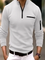 Dettaglio di polo bianca a maniche lunghe con tasche nere con cerniera su petto e braccio - Taglia S / Top / Bianco