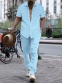 Detail of light blue short sleeve ribbed shirt and trousers set on a street background - Light Blue