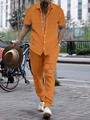 Detail view of orange waffle texture short sleeve shirt and long pants set for men - S / Top And Bottom / Orange