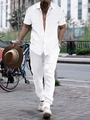 Close-up detail of white short-sleeve shirt with vertical striped texture for men - White