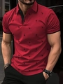 Close-up of red flamingo print polo shirt showing the collar and button details - S / Burgundy