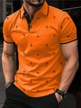 Close-up detail of the orange polo shirt featuring black flamingo prints and collar piping - S / Orange