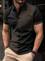 Detailaufnahme des Herren-Poloshirts mit braun-schwarzem Farblock und Waffelstrickstruktur - S / Schwarz-Kaffee Patchwork
