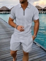Dettaglio del set polo e pantaloncini grigio chiaro con zip e maglia strutturata - S / Grigio