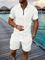 Dettaglio della polo bianca con motivo a maglia geometrica e colletto con zip - S / Bianco