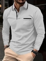 Close-up detail of the contrast striped collar and front pocket on the men's long sleeve polo - S / Gray