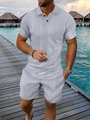 Dettaglio del set polo grigio chiaro con trama jacquard geometrica e colletto classico a bavero - S / Grigio