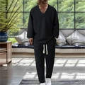 Men's minimalist black textured V-neck long sleeve set with drawstring pants in a cozy room - S / Black