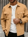 Detailed close-up of khaki utility jacket showing collar, flap pockets and metal buttons - S / Khaki
