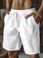 Detailed close-up of white cotton linen shorts featuring elastic drawstring waistband and texture - S / White