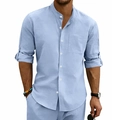 Detail of light blue linen shirt featuring a band collar and buttoned roll-up sleeves - S / Tops / Light Blue