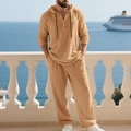 Detail of khaki linen two-piece set featuring hooded Henley shirt and drawstring trousers - Earthy Yellow