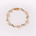 Elegantes Goldarmband mit grünen Blättern und weißen Zirkonia-Blumen für Damen. - Gold Weiß Kleeblatt