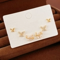 Ensemble de boucles d'oreilles papillon avec finition dorée et cristaux étincelants - Style Papillon Strass (79) / Or