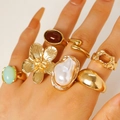 Macro detail of vintage gold alloy ring set with floral and irregular pearl-like designs - Drip Glaze Flower Pearl Set (7099)