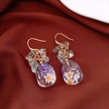 Close-up of teardrop resin earrings with purple and white natural dried flowers inside - Flower Style (HE32042) / Blue