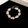 Vintage silver textured oval link bracelet with hammered finish design - Bracelet / Silver