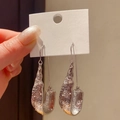 Vintage style textured silver-tone U-shaped dangle earrings with elegant design - Silver