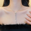 Detailed view of elegant French style pearl necklace featuring a rhinestone tassel fringe - Style 24