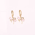 Elegant gold-plated hoop earrings featuring a sparkling pink zircon bow pendant. - Gold Pink Zirconia