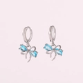 Elegant silver-toned huggie hoop earrings with light blue zircon bow-knot pendants - Platinum Blue Zirconia