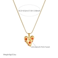 Detailed macro view of gold-plated stainless steel heart pendant necklace with red stones - Heart Style (N4205)