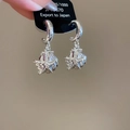 Eleganti orecchini a cerchio argentati a forma di C con ciondoli a stella marina e conchiglia. - Stile Conchiglia e Stella Marina / Argento