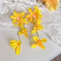 Elegant yellow fabric flower tassel earrings with pearl accents for a vacation look. - Layered Petal Tassel Style (57#) / Yellow-Gold