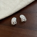 Detailed view of French-style pearl ear clips with sparkling stones on wooden background - Clip-On Earrings / Silver