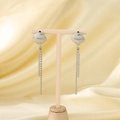 Elegant silver stainless steel shell tassel drop earrings displayed on a beige stand - Tassel Style / Steel