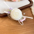 Close-up of handmade white fabric rose hair clip with colorful flower accents and ribbons - Duckbill Hair Clips / 1 Piece / Pink-Purple
