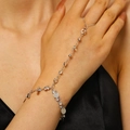 Close-up of elegant silver hand harness bracelet with zircons and sequins on model - 仿钻亮片连指手链(2582) / Silver