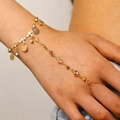 Elegant gold-tone hand harness bracelet with round metal discs and sparkling crystal beads. - 56 Gold 7016