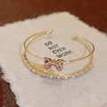 Gold-plated titanium steel bangle with elegant pink crystal butterfly and zircons - Double Layer Bow Bangle / Gold Pink