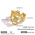 Golden stainless steel heart ring with oval green gemstone and clover cutout detail - Pale Green