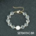 Elegant beaded bracelet with clear faceted beads, white pearl, and gold-plated adjustable chain - Clear Quartz Bracelet