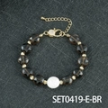 Perlenarmband mit Rauchkristallperlen, Muschelperlenakzent und Goldbeschichtung - Rauchquarz
