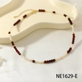 Elegant beaded necklace with white pearls and dark red faceted stones with gold clasp - Garnet