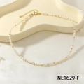 Elegant beaded necklace featuring white pearls, blue opal beads, and golden clasp hardware - White Crystal