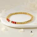 Boheems gouden kralenarmband met gemengde rode en witte halfedelstenen model A - Rode Kralen Stijl (BR1903-A)