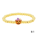 Detail of Halloween gold bead bracelet featuring a pumpkin charm with purple wizard hat - Purple Witch Hat Pumpkin (BR1914-B-1)