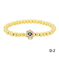 Close-up of golden beaded bracelet with skull charm and colorful crystal accents - Floral Skull (BR1914-D-2)